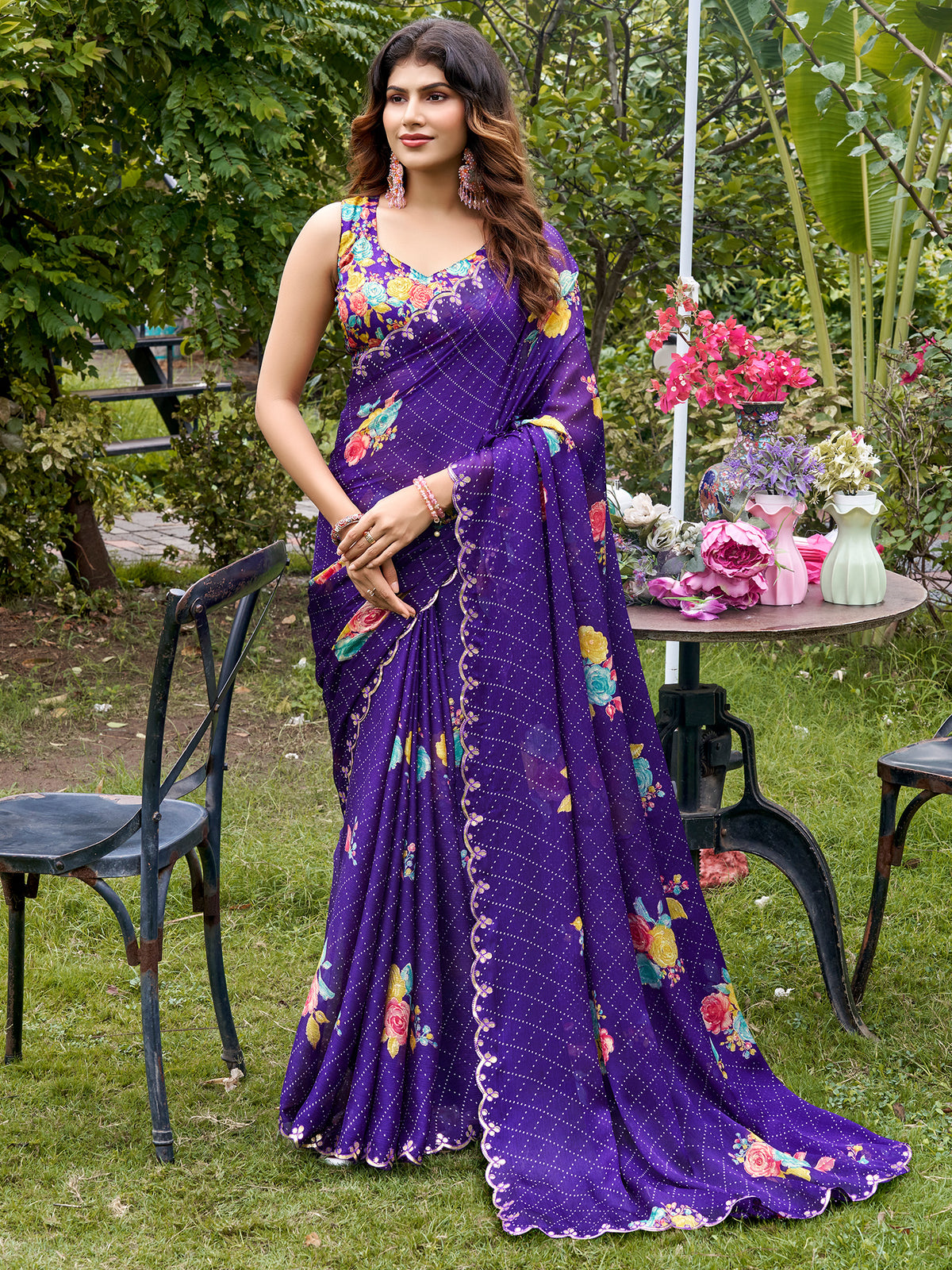 Woman wearing purple chiffon saree with metallic foil print work and multicolored blouse