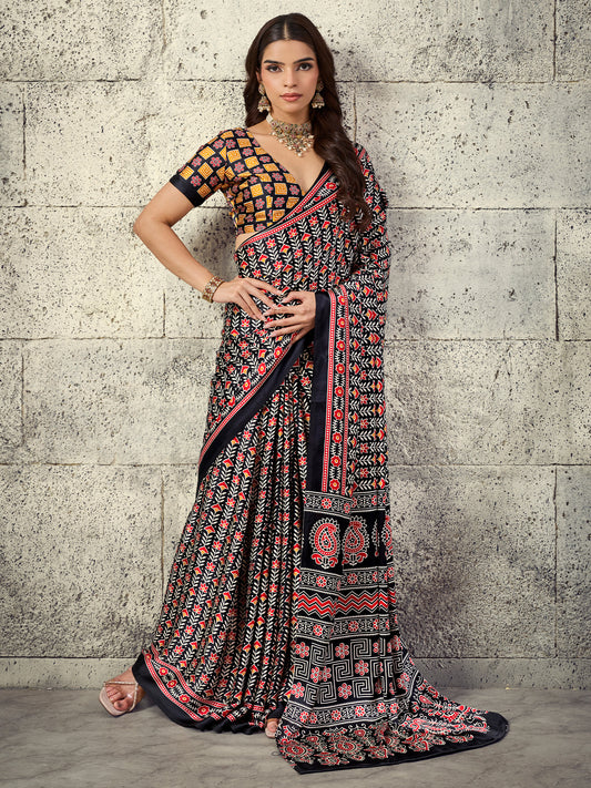 Woman wearing black satin saree with ajrak block-print motif work and black blouse