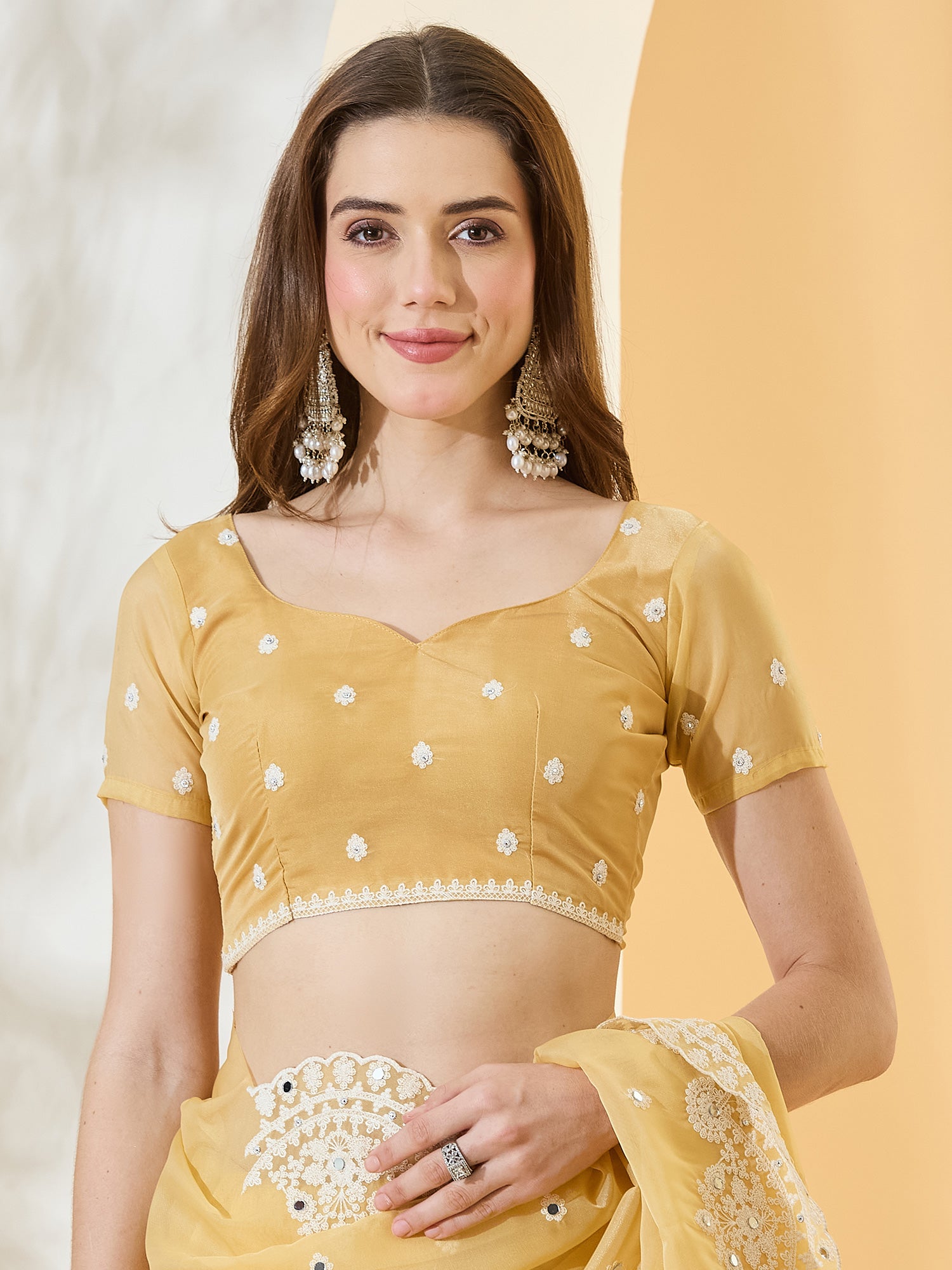 Unstitched yellow organza blouse piece with embroidered design