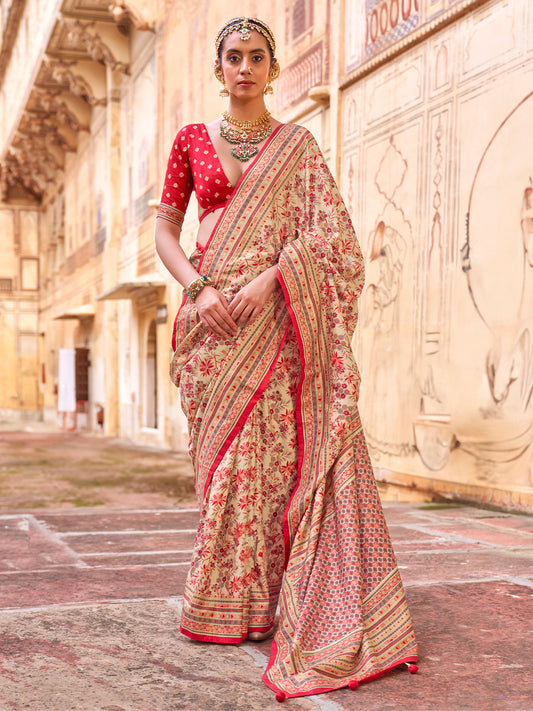 Woman wearing cream silk blend saree with kalamkari narrative motif work and red blouse