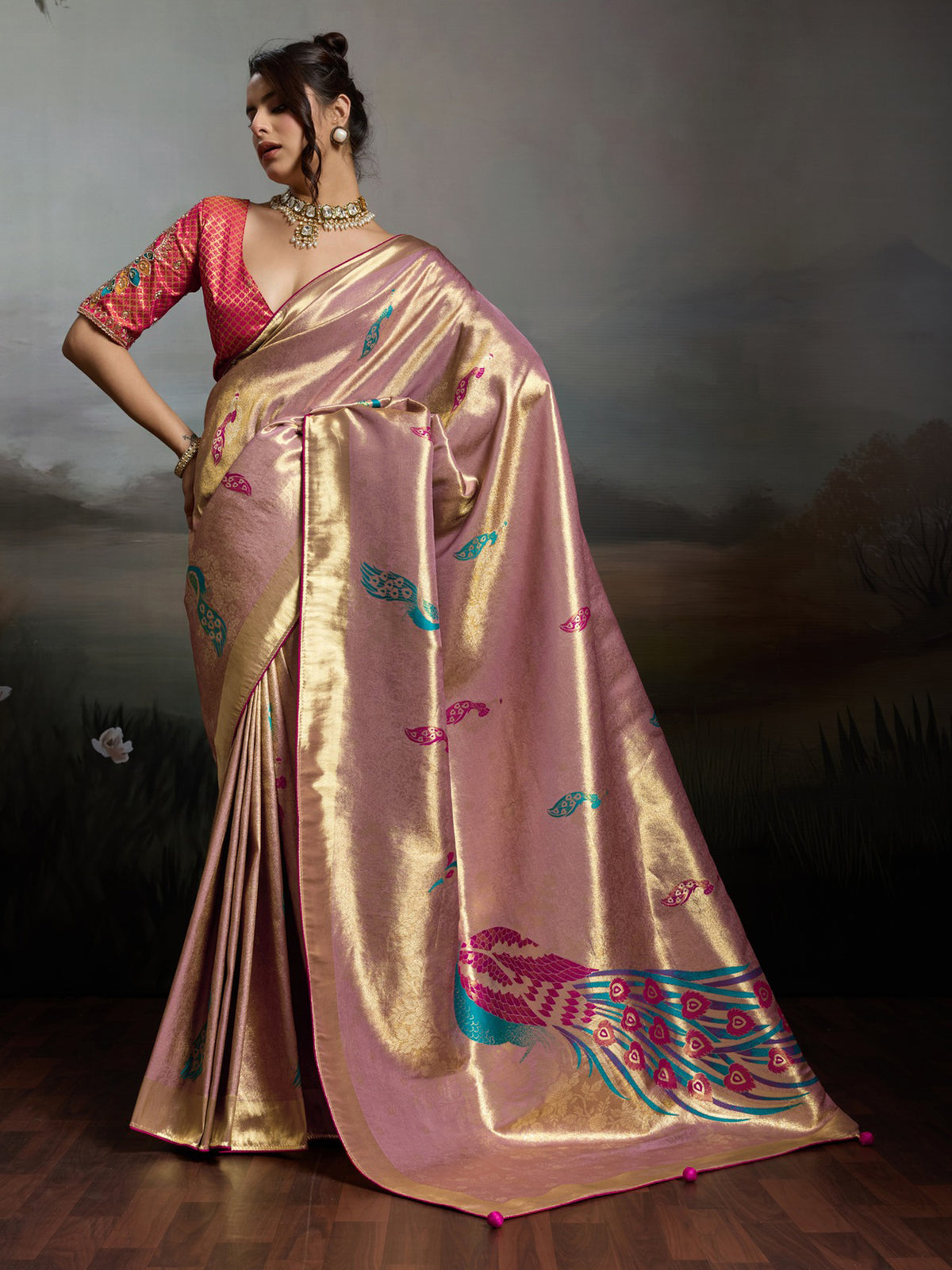 Woman wearing pink banarasi silk saree with woven motif design and pink blouse
