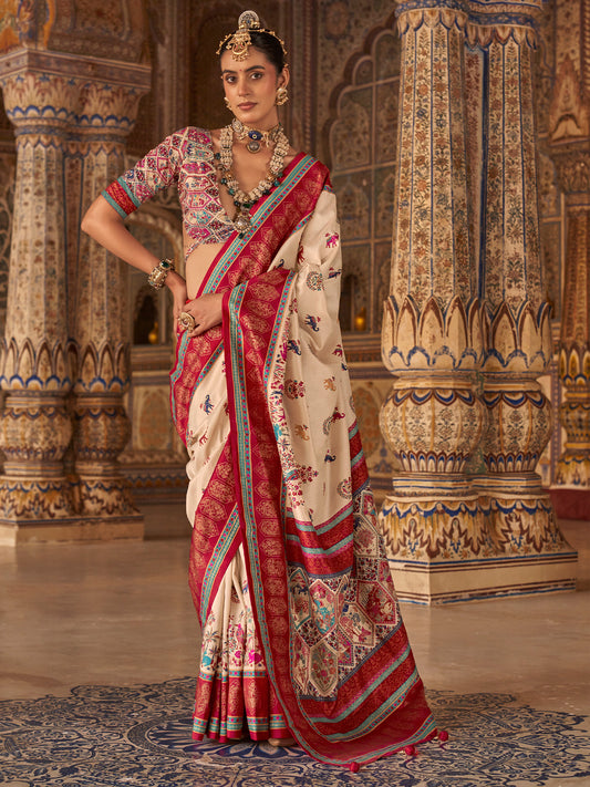 Woman wearing cream silk blend saree with traditional indian motif work and multicolored blouse