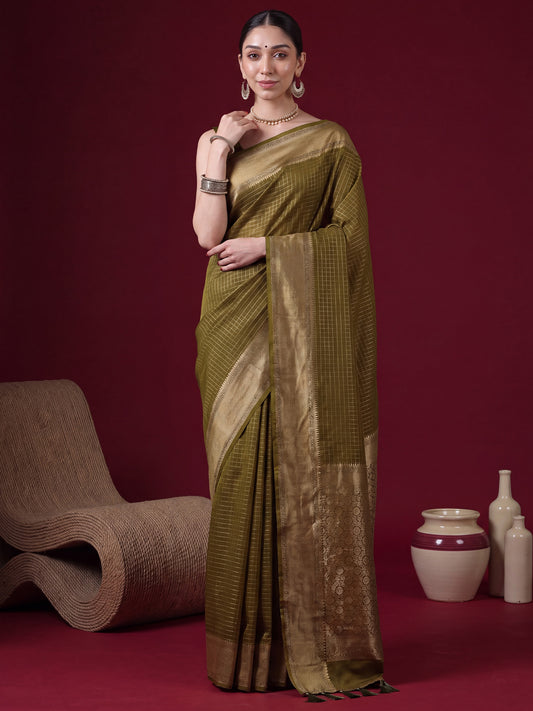 Woman wearing olive banarasi silk saree with checkered design and olive blouse