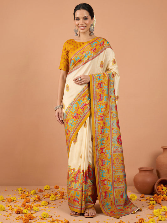 Woman wearing mustard silk blend saree with metallic foil print work and mustard blouse