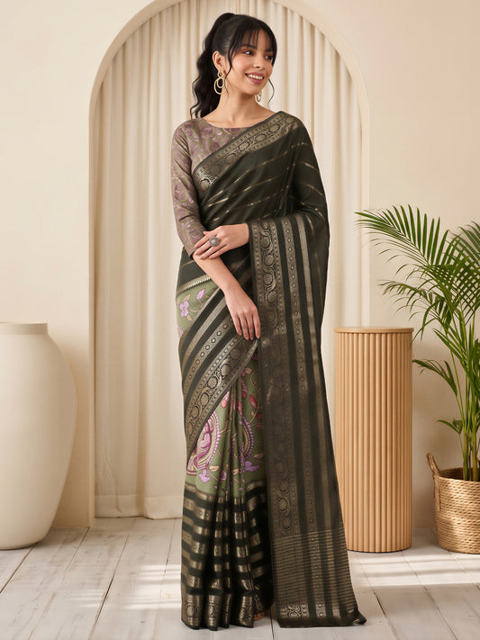Woman wearing green viscose silk saree with traditional indian motif work and sea green blouse
