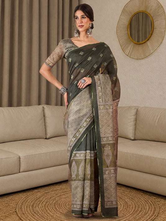 Woman wearing olive silk blend saree with all-over floral design and olive blouse