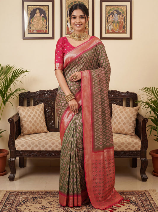 Woman wearing light green silk blend saree with geometric pattern design and red blouse