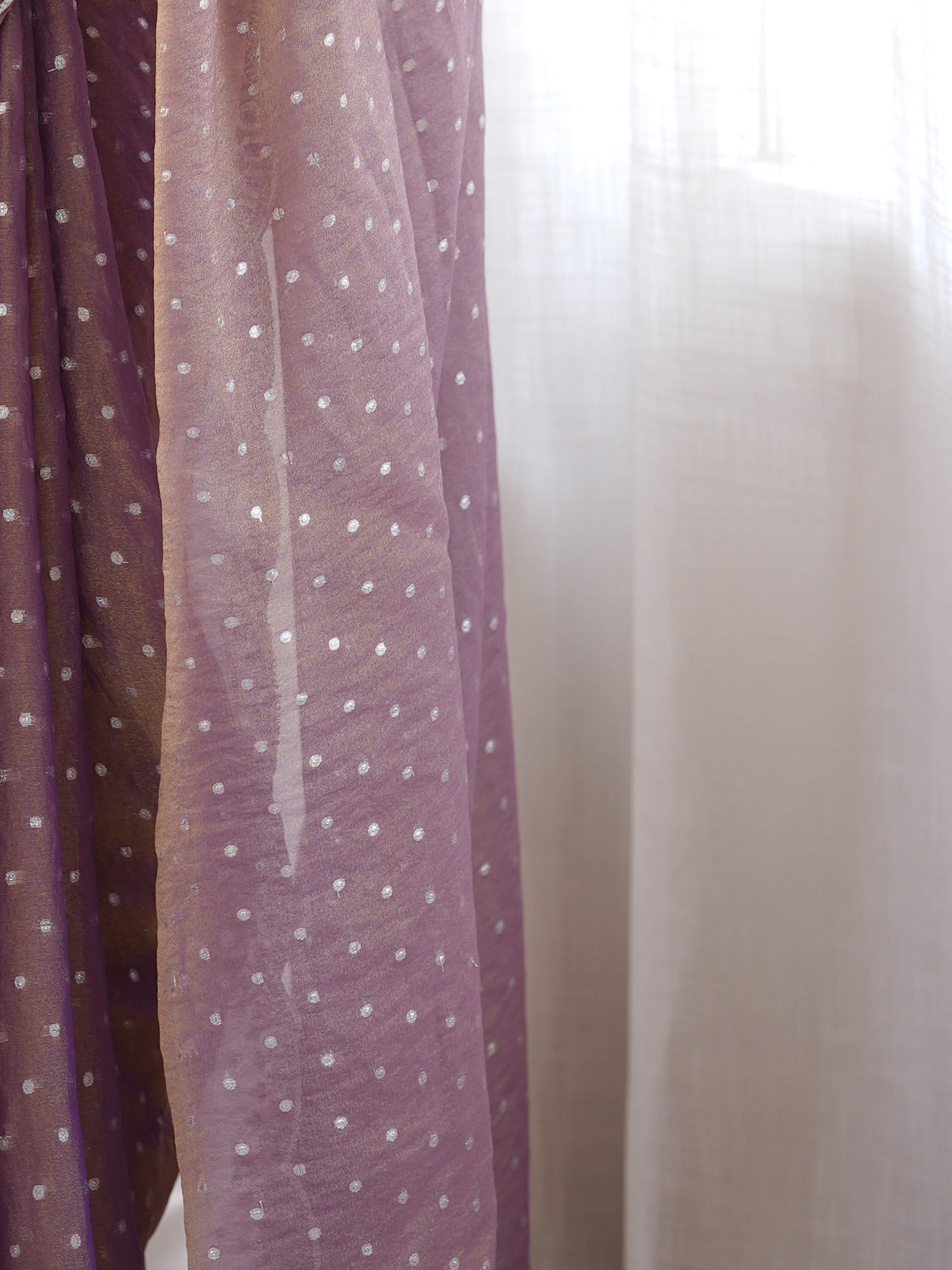 Pallu detail of lavender silk blend saree showing ornamented surface design and scallop border