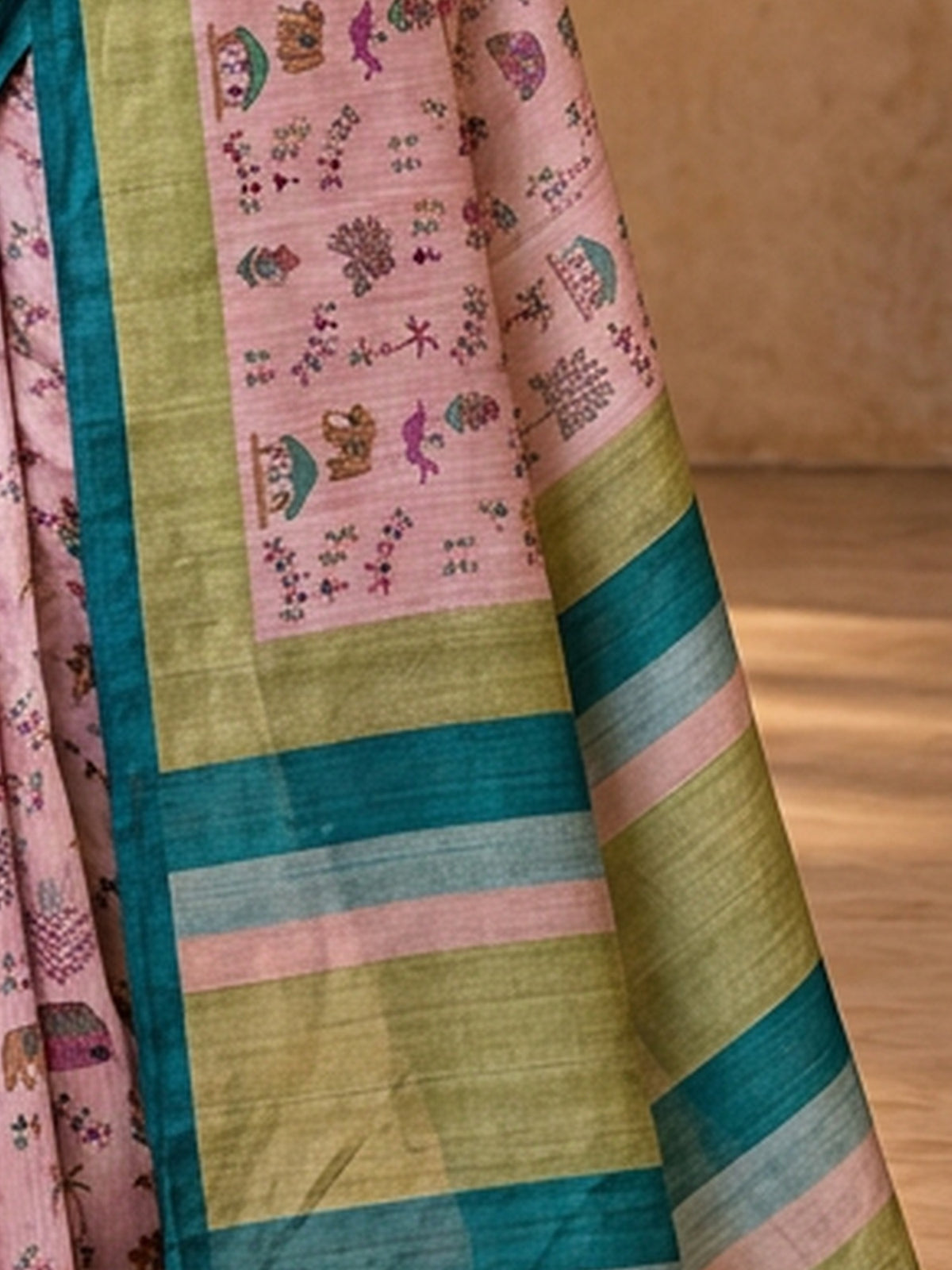 Pallu detail of lavender soft silk saree showing tribal folk-art motifs and printed border