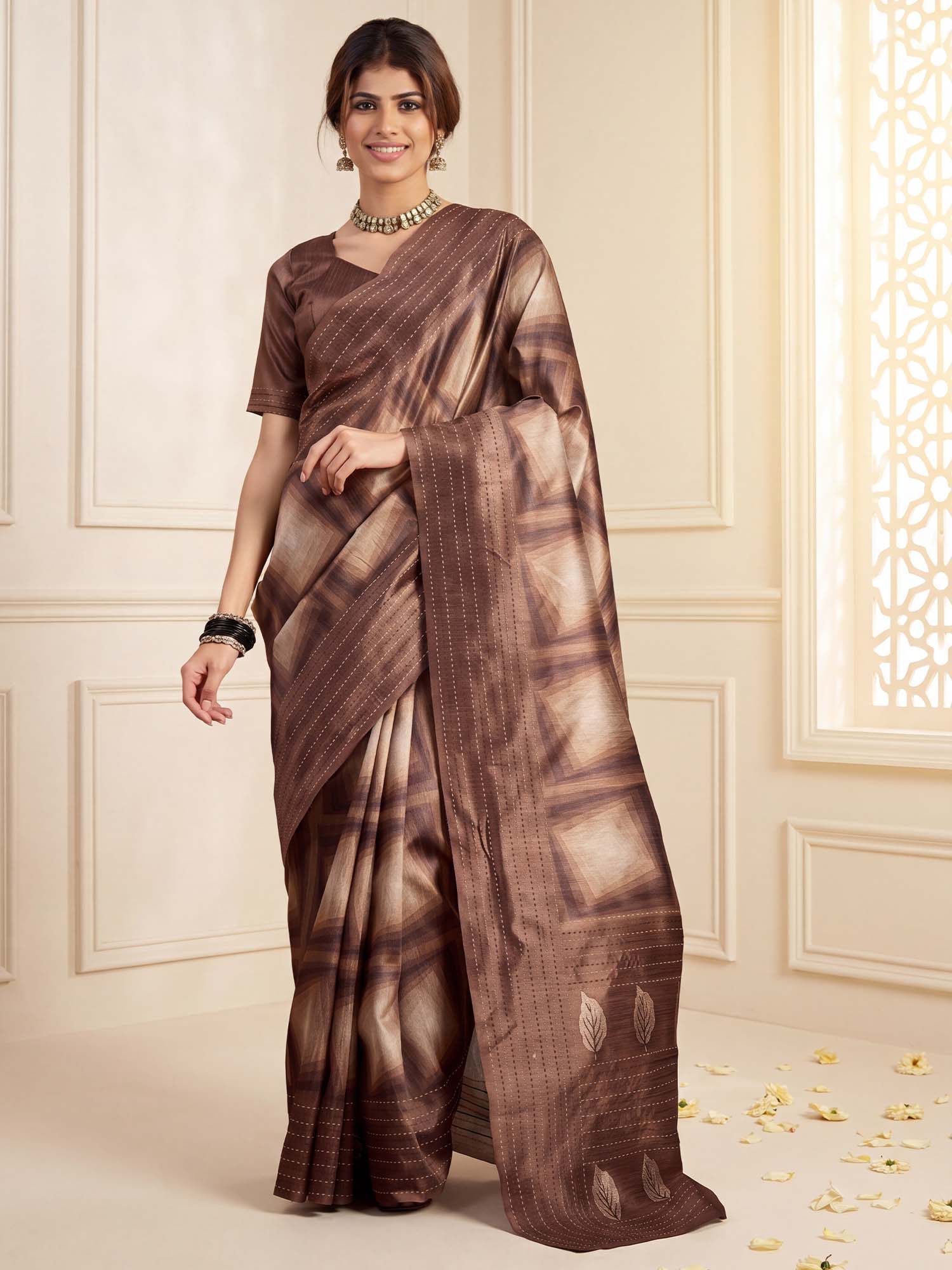 Woman wearing camel brown cotton silk saree with geometric pattern design and camel brown blouse