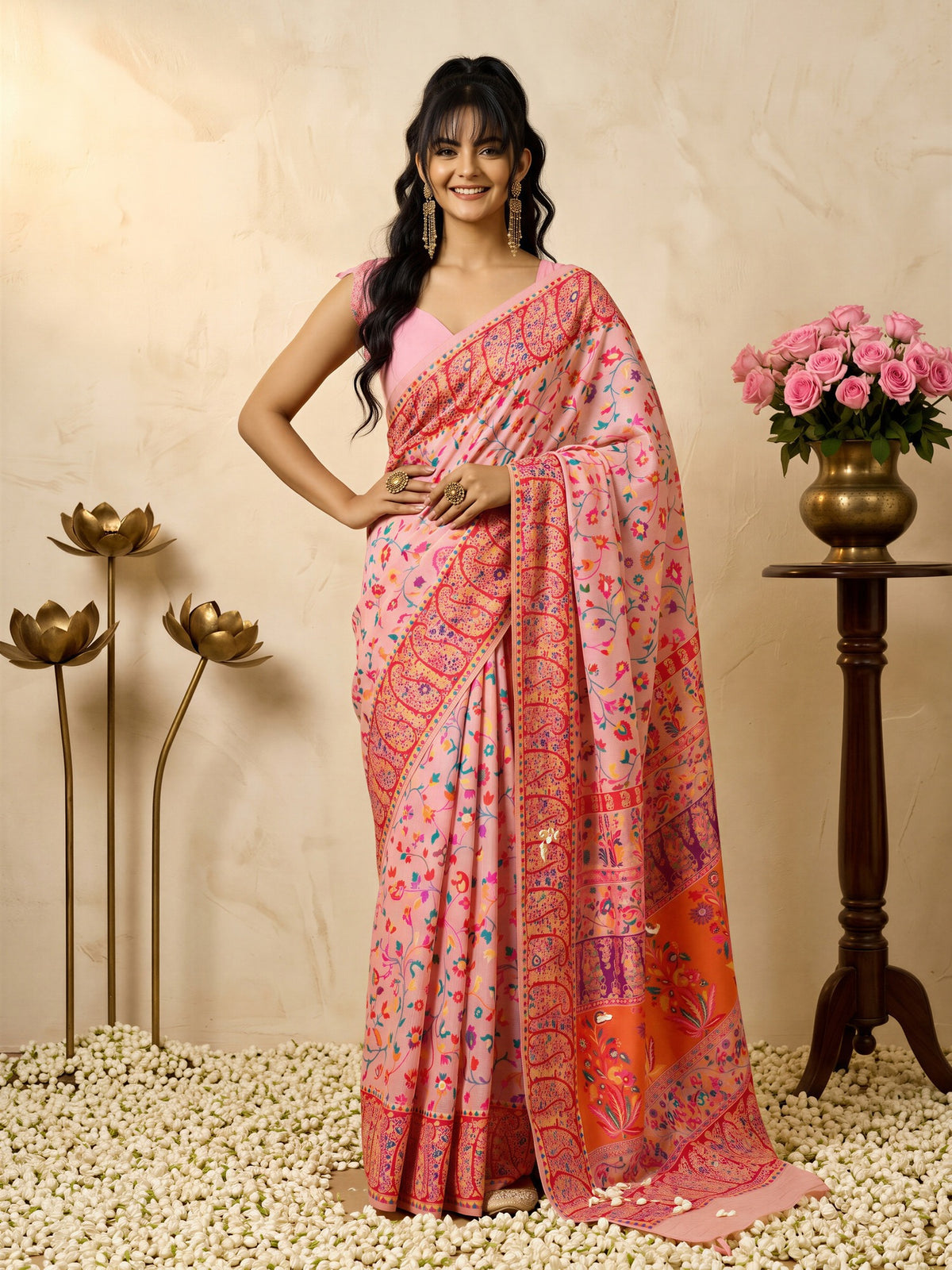 Woman wearing pink cotton silk saree with all-over floral design and pink blouse