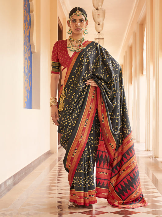 Black ikat silk blend saree with red blouse piece