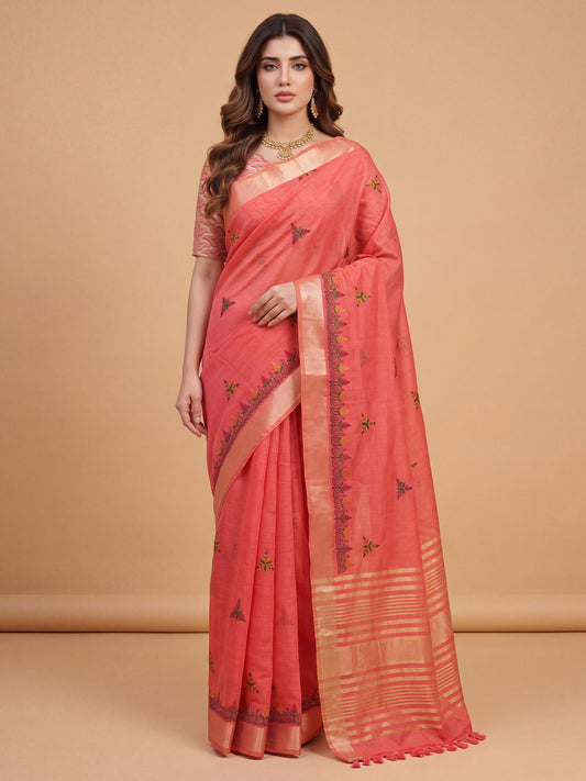 Woman wearing peach cotton linen saree with embroidered motif work and peach blouse