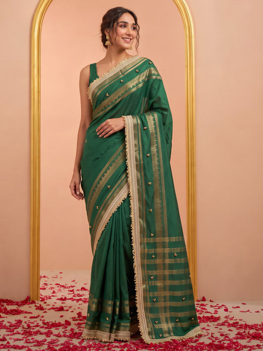 Green woven design soft silk saree with green blouse piece