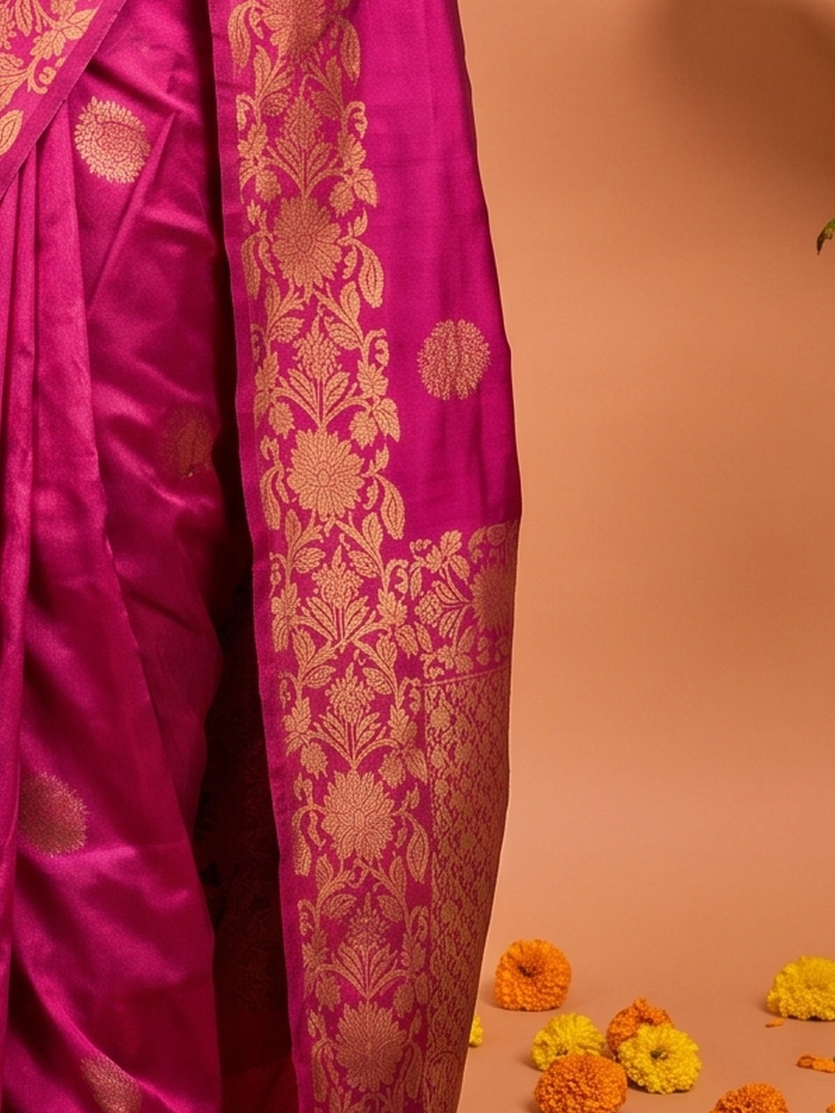 Pallu detail of magenta silk blend saree showing zari butta (metallic motif) work and zari border