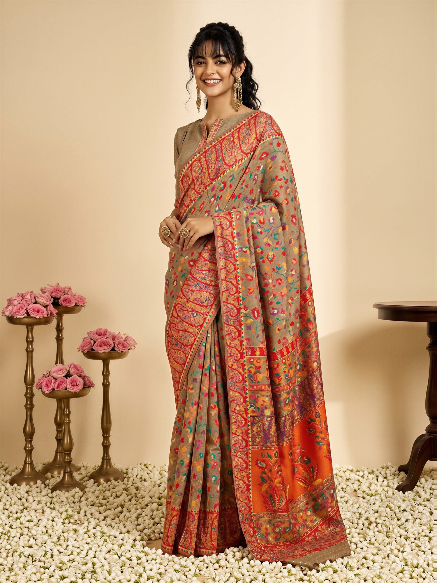 Woman wearing beige cotton silk saree with all-over floral design and beige blouse