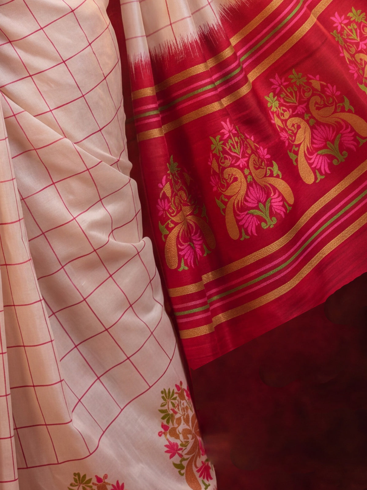 Pallu detail of off white silk blend saree showing traditional indian motif work and solid border