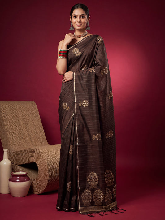 Woman wearing dark brown satin silk saree with zari butta (metallic motif) work and dark brown blouse