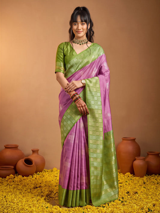 Woman wearing purple cotton blend saree with traditional indian motif work and sea green blouse