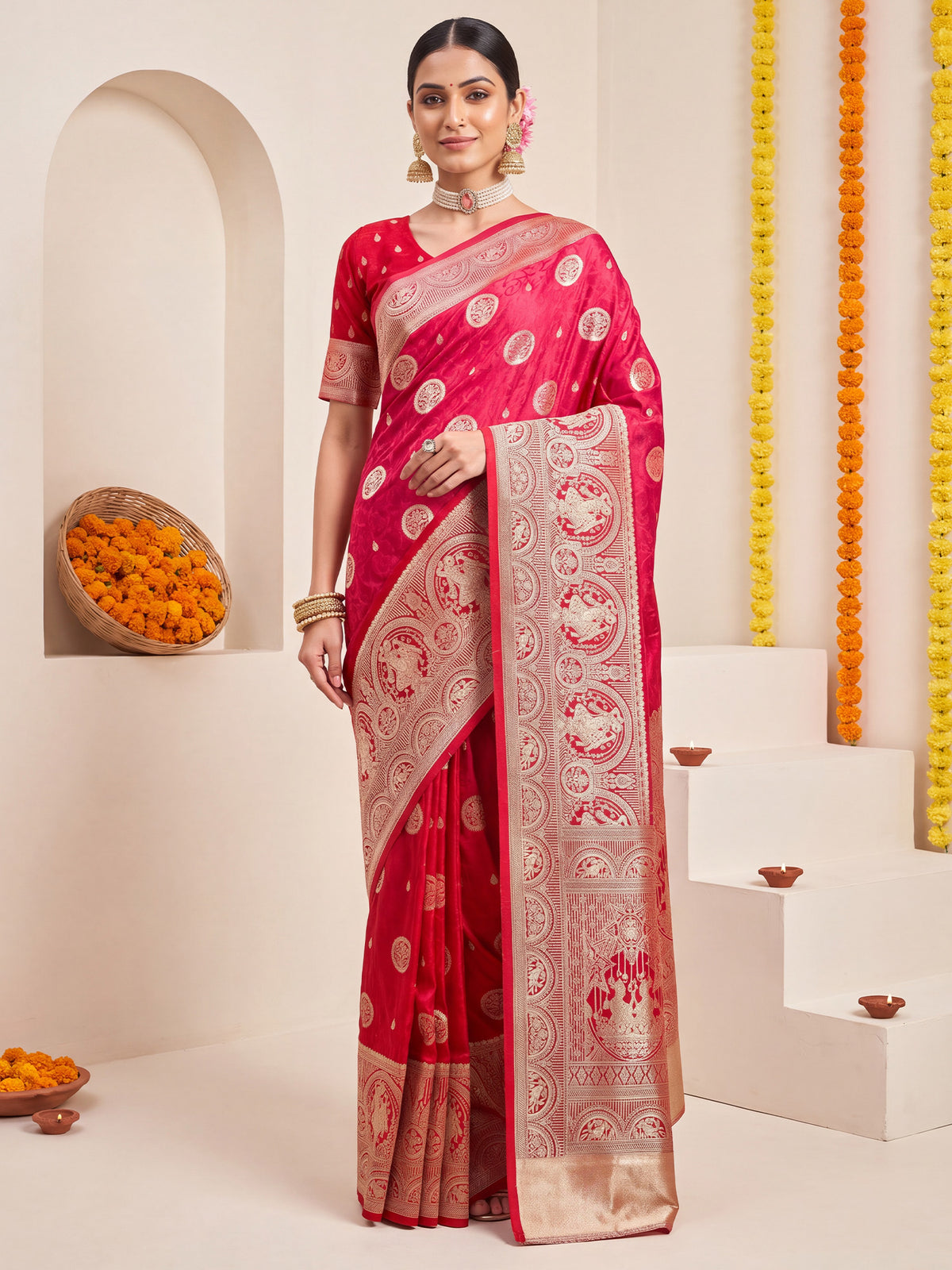 Woman wearing pink satin silk saree with zari butta (metallic motif) work and red blouse