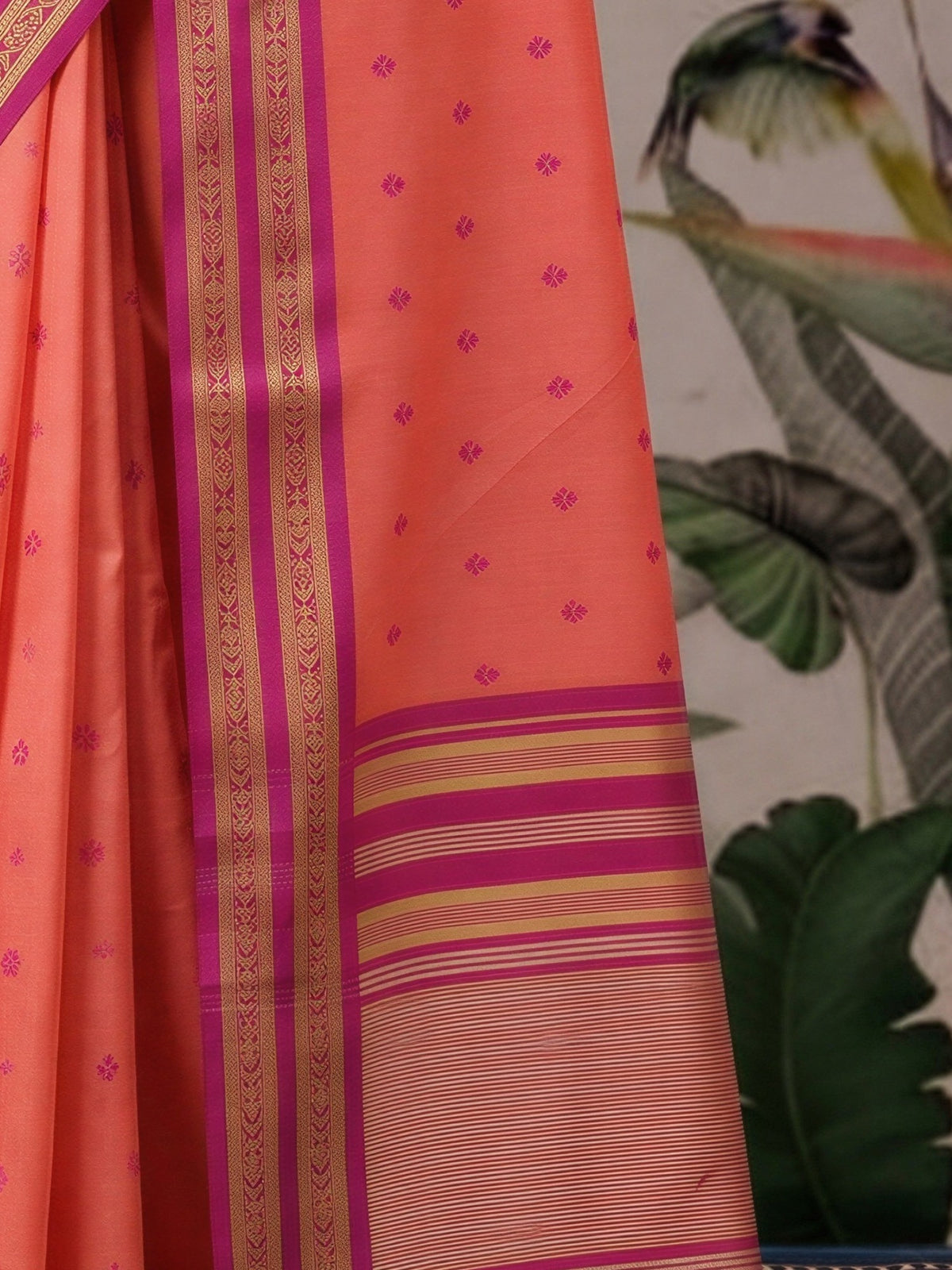 Pallu detail of peach cotton blend saree showing woven motif design and zari border