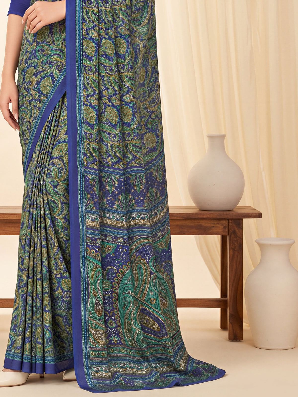 Pallu detail of navy blue crepe saree showing bagh block-print motif work and printed border