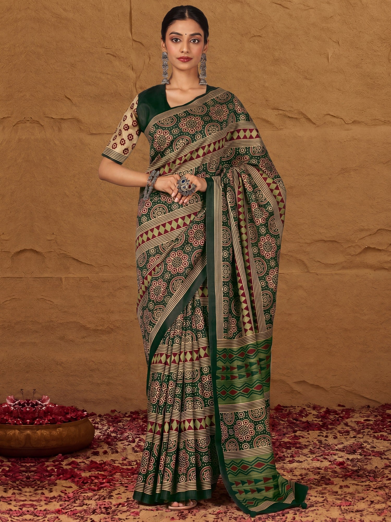 Woman wearing green silk blend saree with ajrak block-print motif work and green blouse