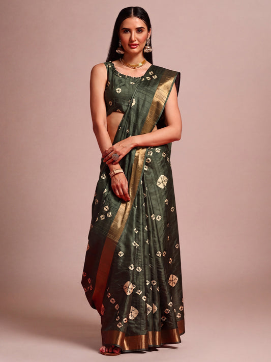 Woman wearing dark green silk blend saree with traditional indian motif work and dark green blouse