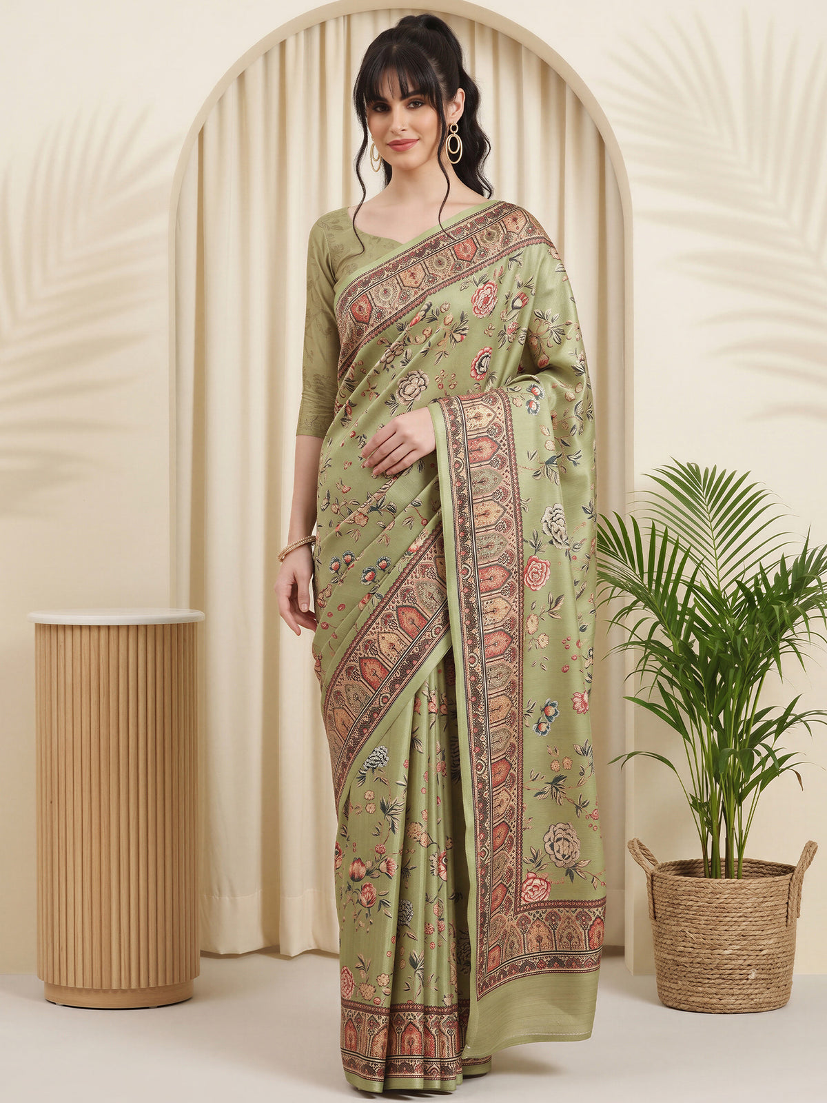 Woman wearing olive cotton blend saree with botanical floral and leaf design and olive blouse