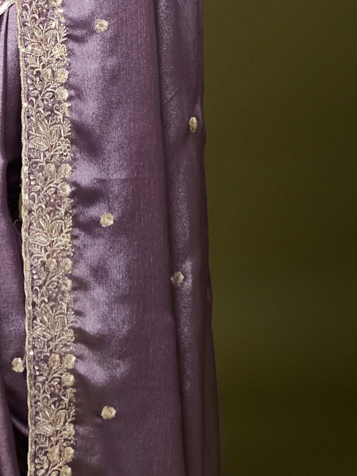 Pallu detail of lavender chinnon saree showing embroidered motif work and scallop border