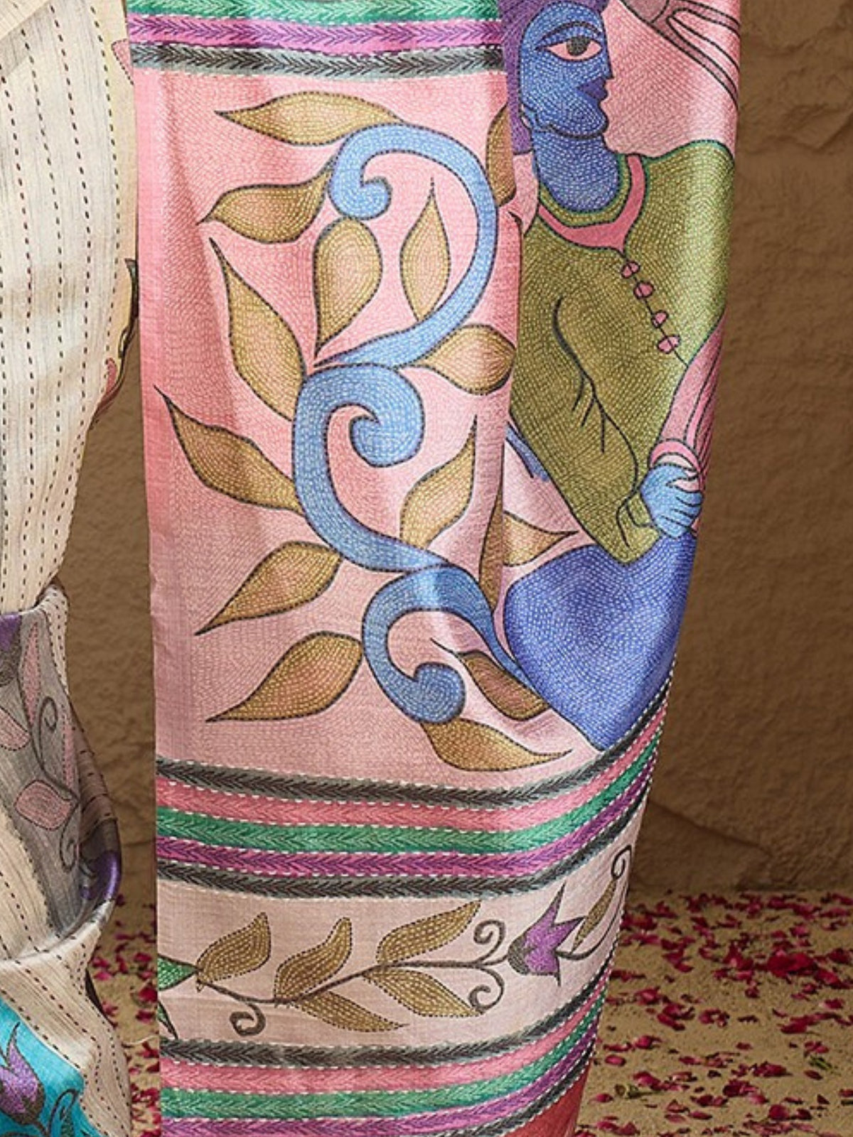 Pallu detail of multicolored art silk saree showing kalamkari narrative motif work and printed border