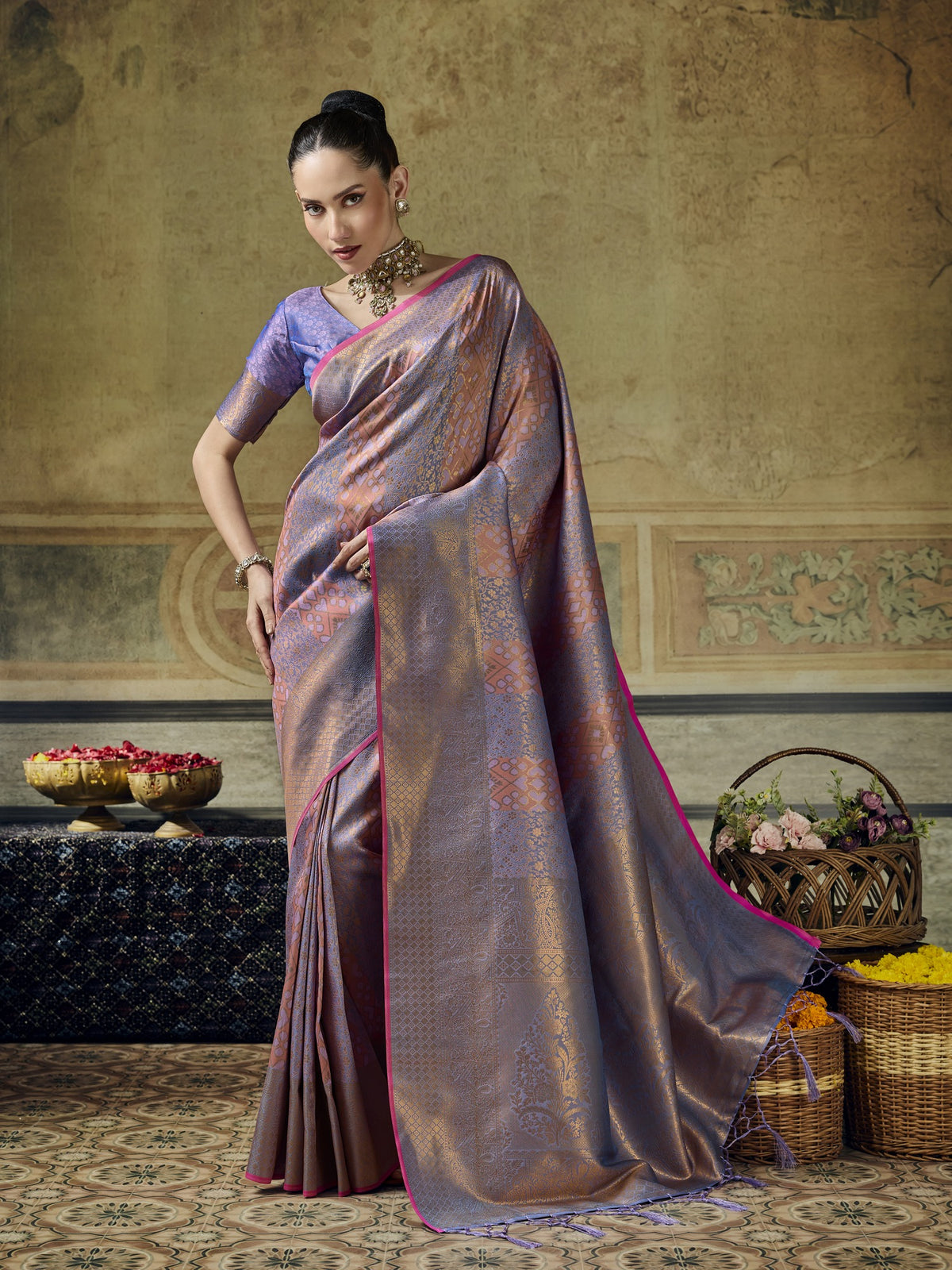 Woman wearing lavender pure silk saree with woven motif design and lavender blouse