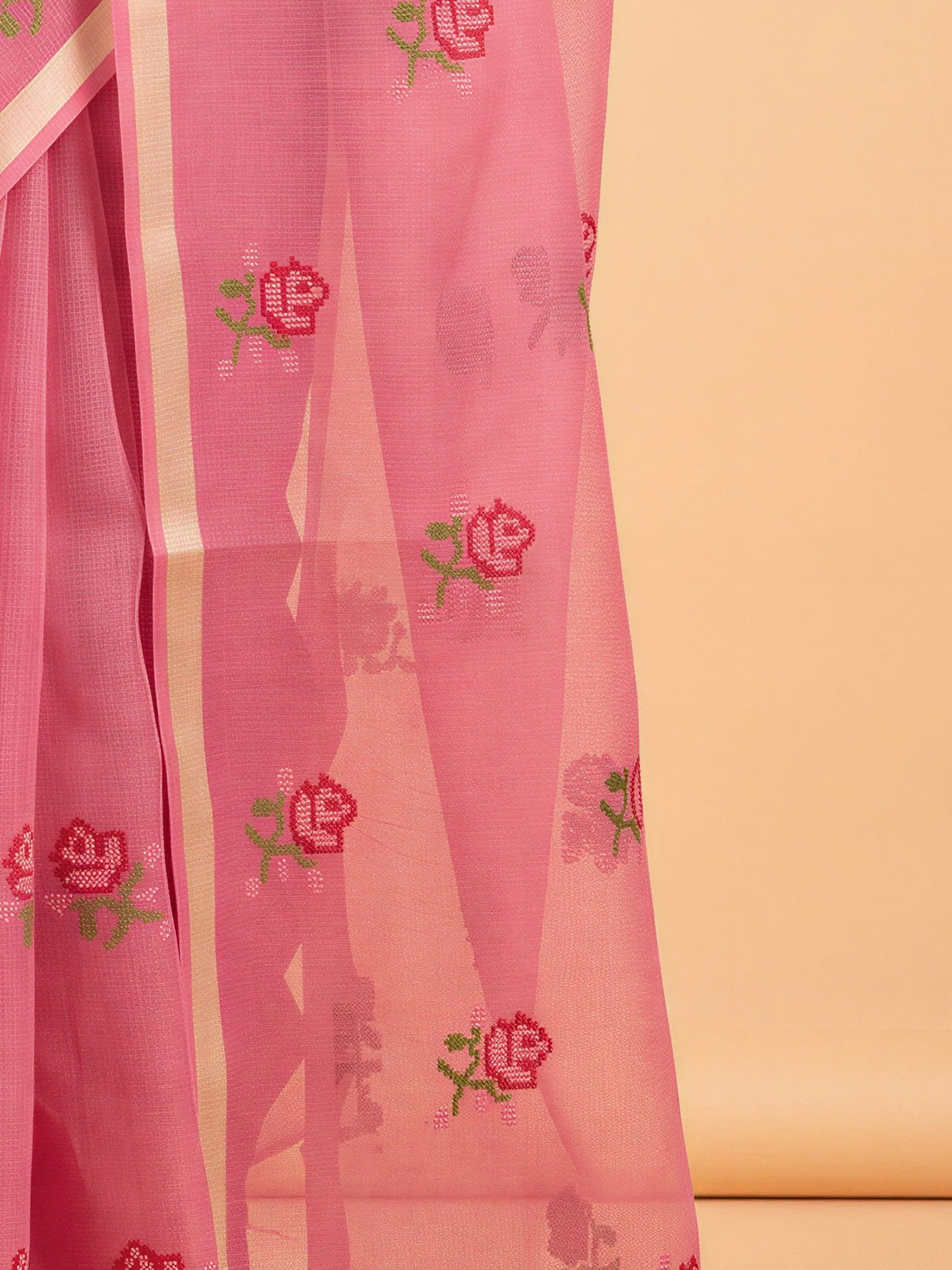 Pallu detail of pink kota doria cotton saree showing embroidered motif work and zari border