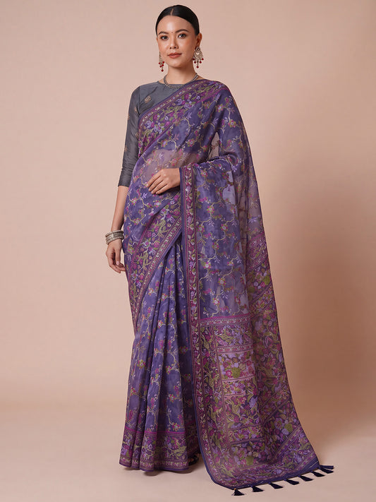 Woman wearing purple organza saree with botanical floral and leaf design and purple blouse