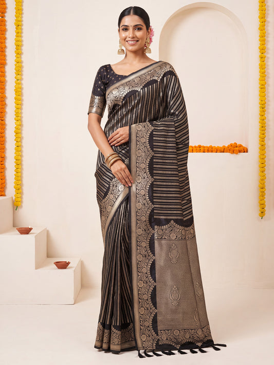 Woman wearing black georgette saree with striped pattern design and black blouse
