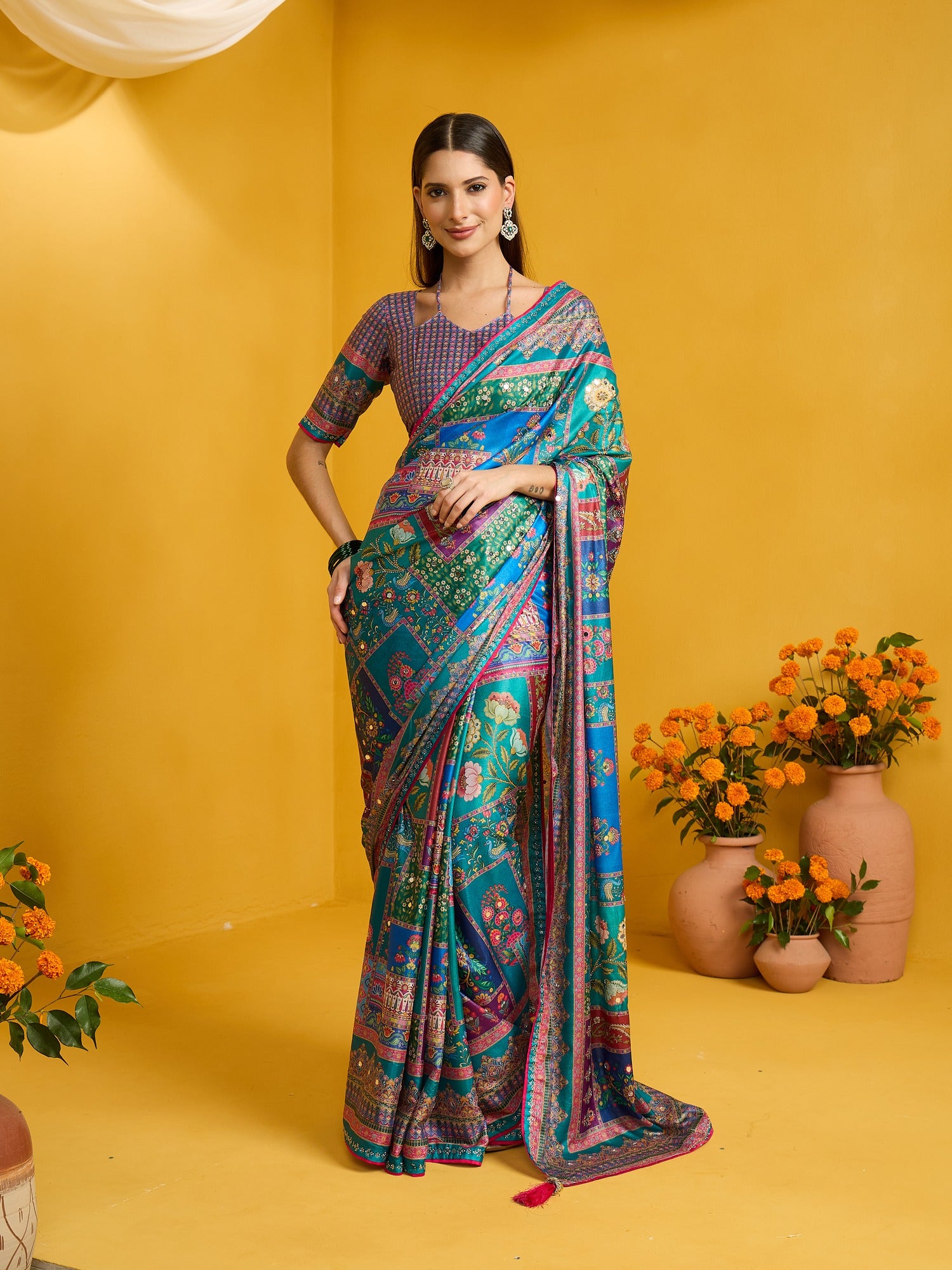 Woman wearing light blue silk blend saree with ornamented surface design and light blue blouse