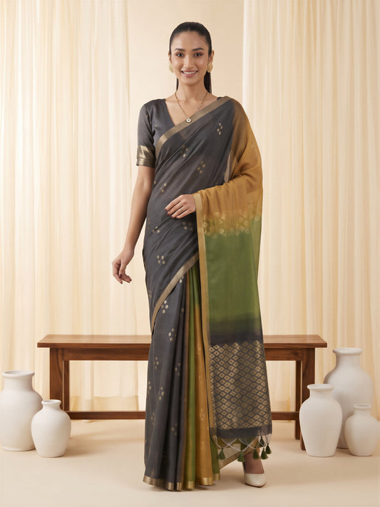 Woman wearing mustard viscose silk saree with traditional indian motif work and black blouse