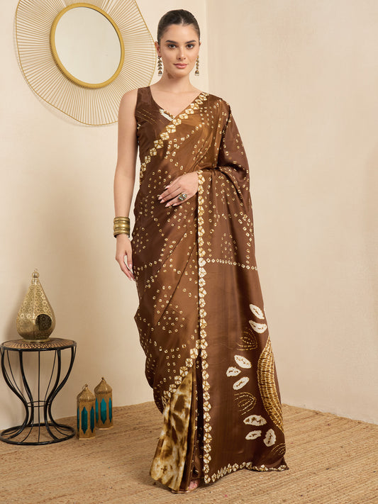 Woman wearing brown crepe saree with bandhani tie-dye dot work and brown blouse