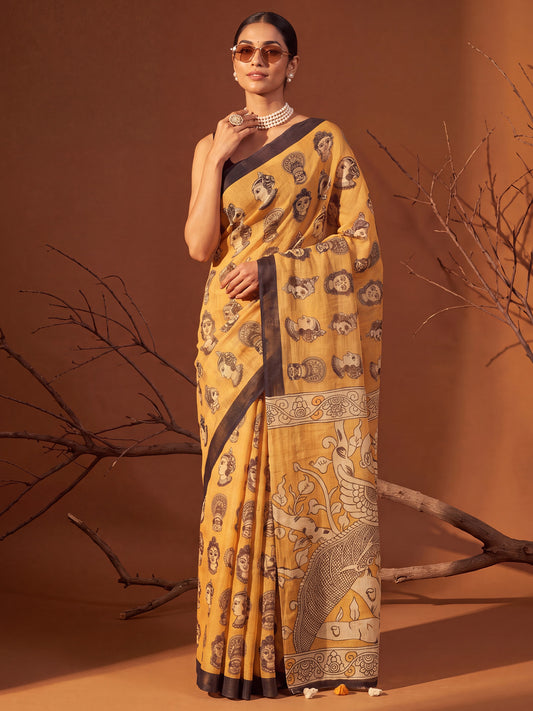 Woman wearing mustard cotton linen saree with kalamkari narrative motif work and black blouse