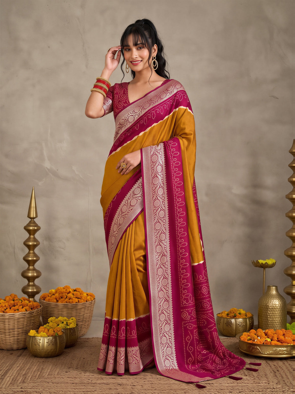 Woman wearing mustard tussar silk saree with bandhani tie-dye dot work and maroon blouse