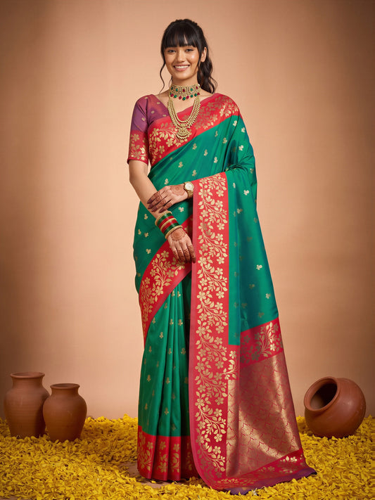 Woman wearing green cotton blend saree with all-over floral design and red blouse