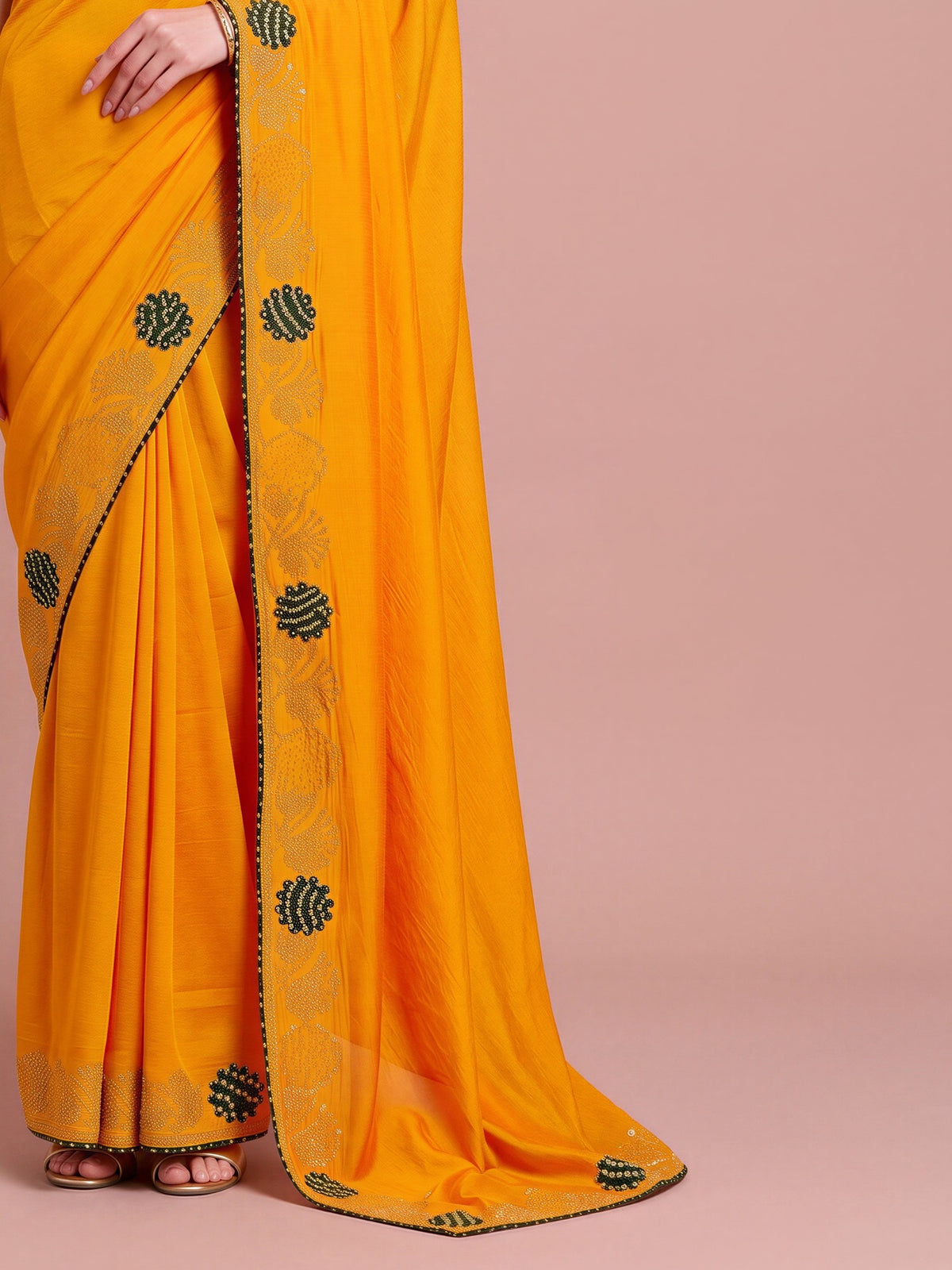Pallu detail of yellow vichitra silk saree showing ornamented surface design and embellished border