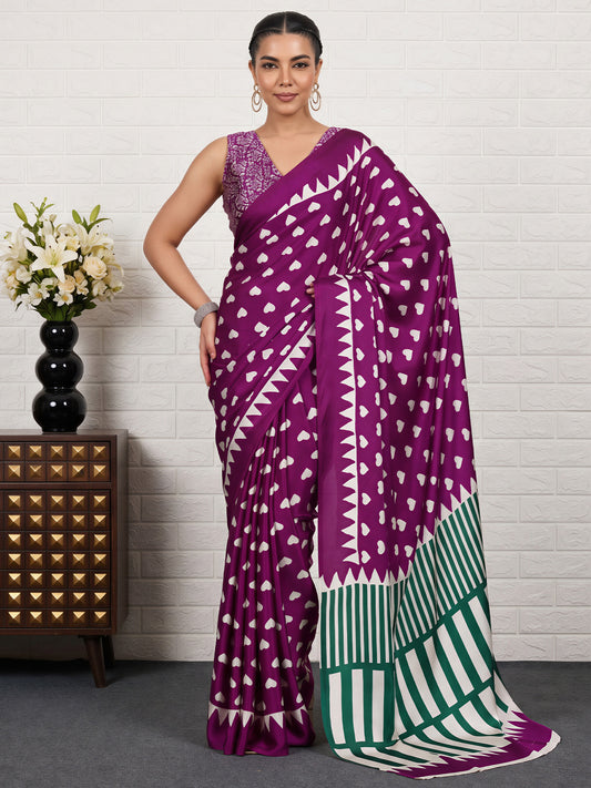 Woman wearing purple satin saree with traditional indian motif work and purple blouse