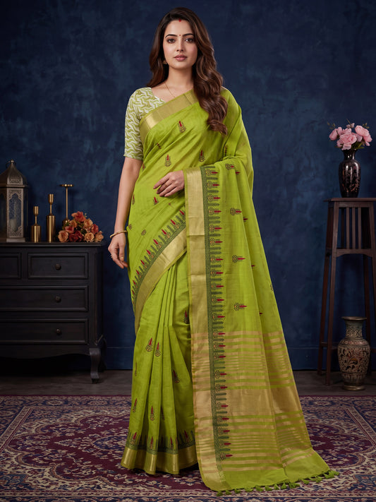 Woman wearing lime green cotton linen saree with embroidered motif work and lime green blouse