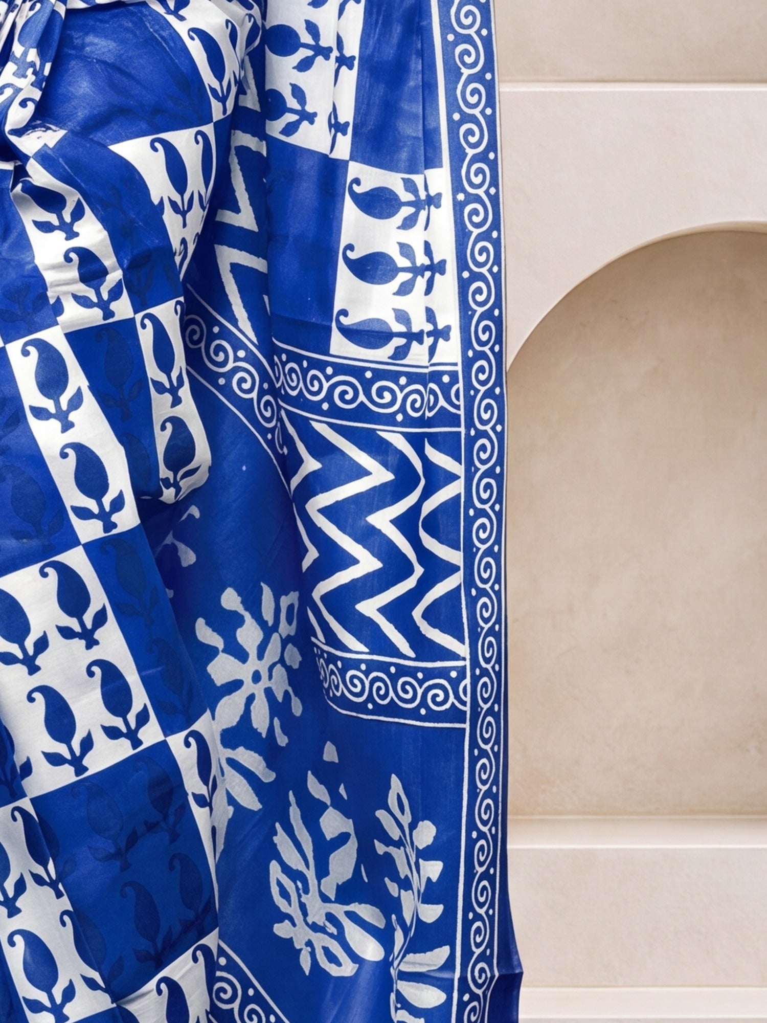Pallu detail of blue cotton saree showing dabu mud-resist print work and printed border