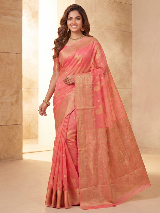 Woman wearing peach silk blend saree with zari butta (metallic motif) work and peach blouse