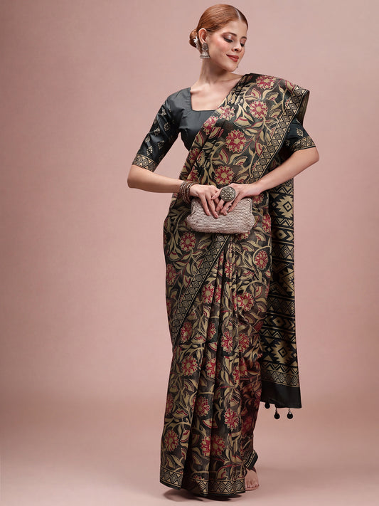 Woman wearing dark green silk blend saree with traditional indian motif work and dark green blouse