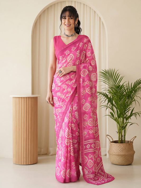 Woman wearing pink georgette saree with batik wax-resist design and pink blouse