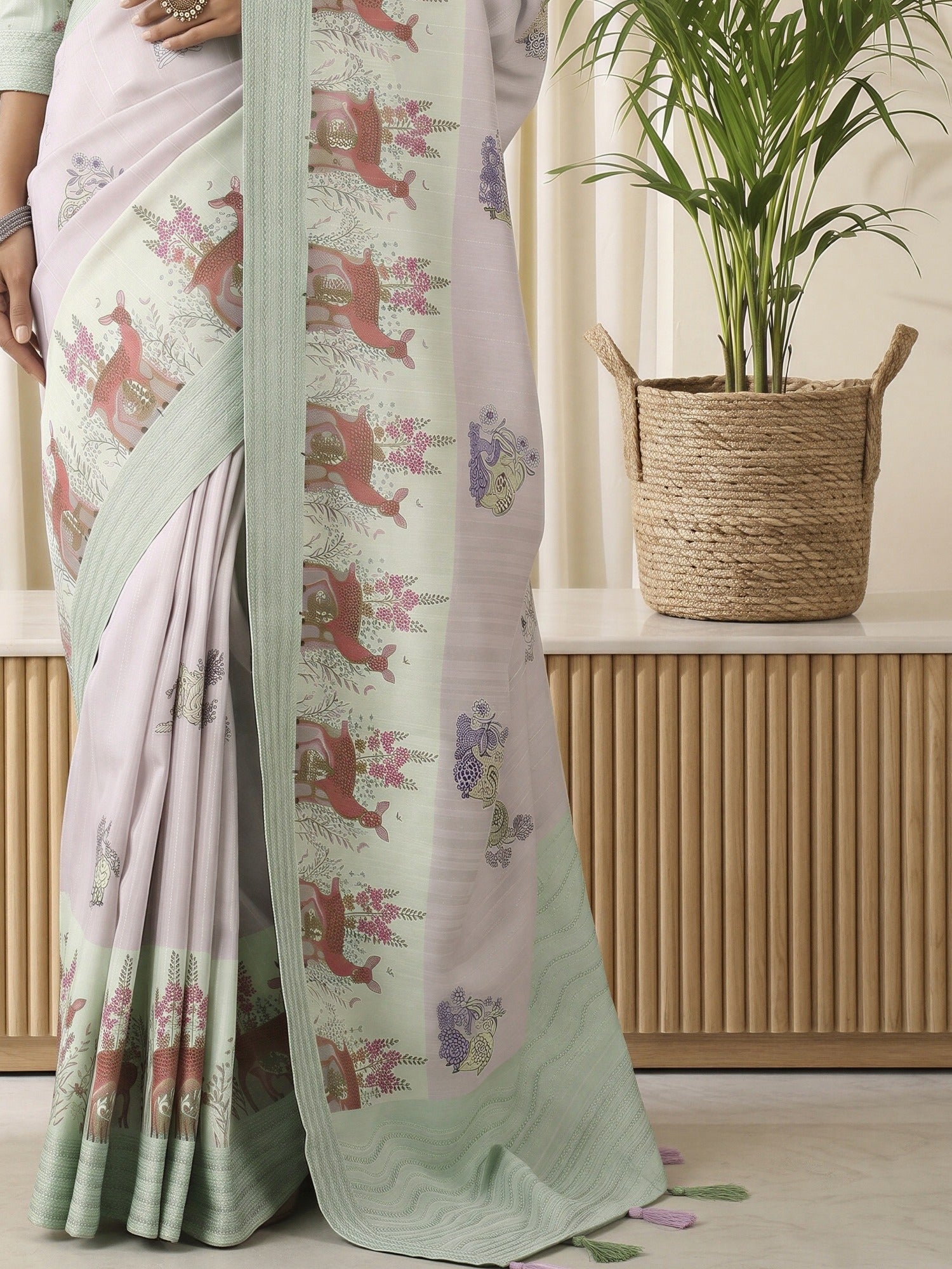 Pallu detail of lavender silk blend saree showing traditional indian motif work and embroidered border