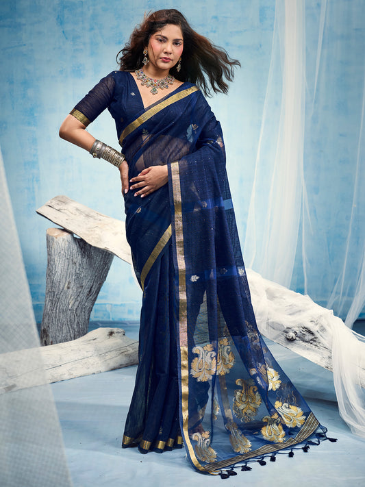 Woman wearing navy blue muga silk saree with zari butta (metallic motif) work and navy blue blouse